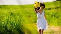 pic for Girl With Yellow Flowers In Field 